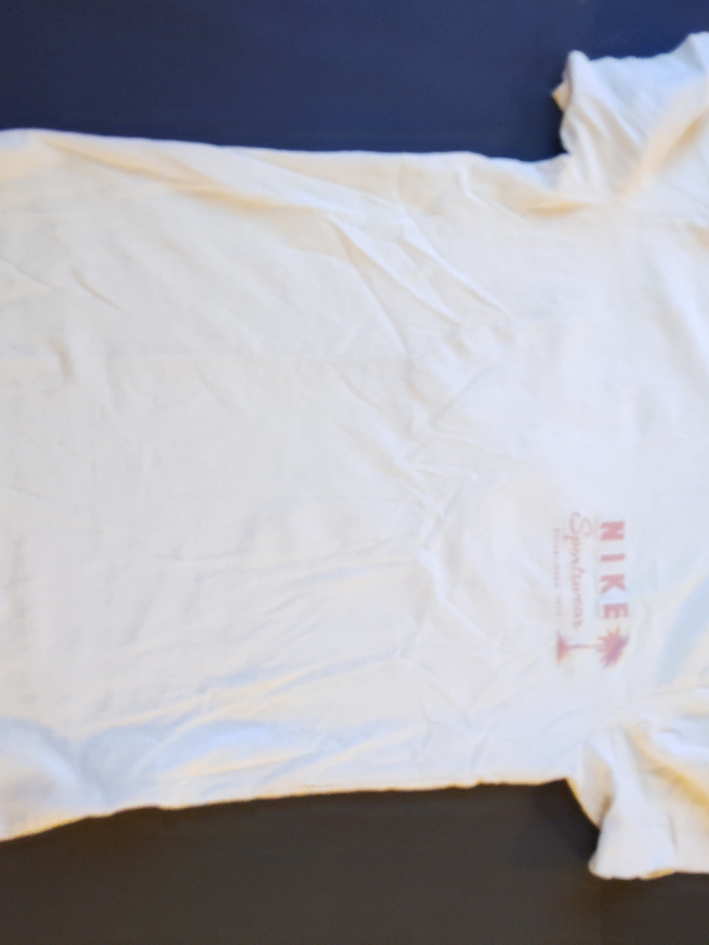 Nike White Short-Sleeve Tee with Pink Logo and Palm Graphic